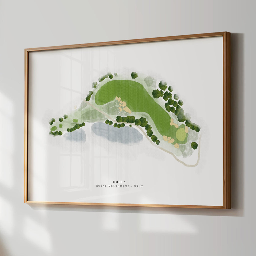 Framed golf course map on a wall in a room with a window